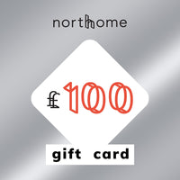 North Home £100 gift card in metallic silver, with the amount in coral inside a white diamond, for Scandinavian homeware and interiors