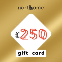 North Home £250 gift card in metallic gold, with the amount in coral inside a white diamond, for Scandinavian homeware and interiors