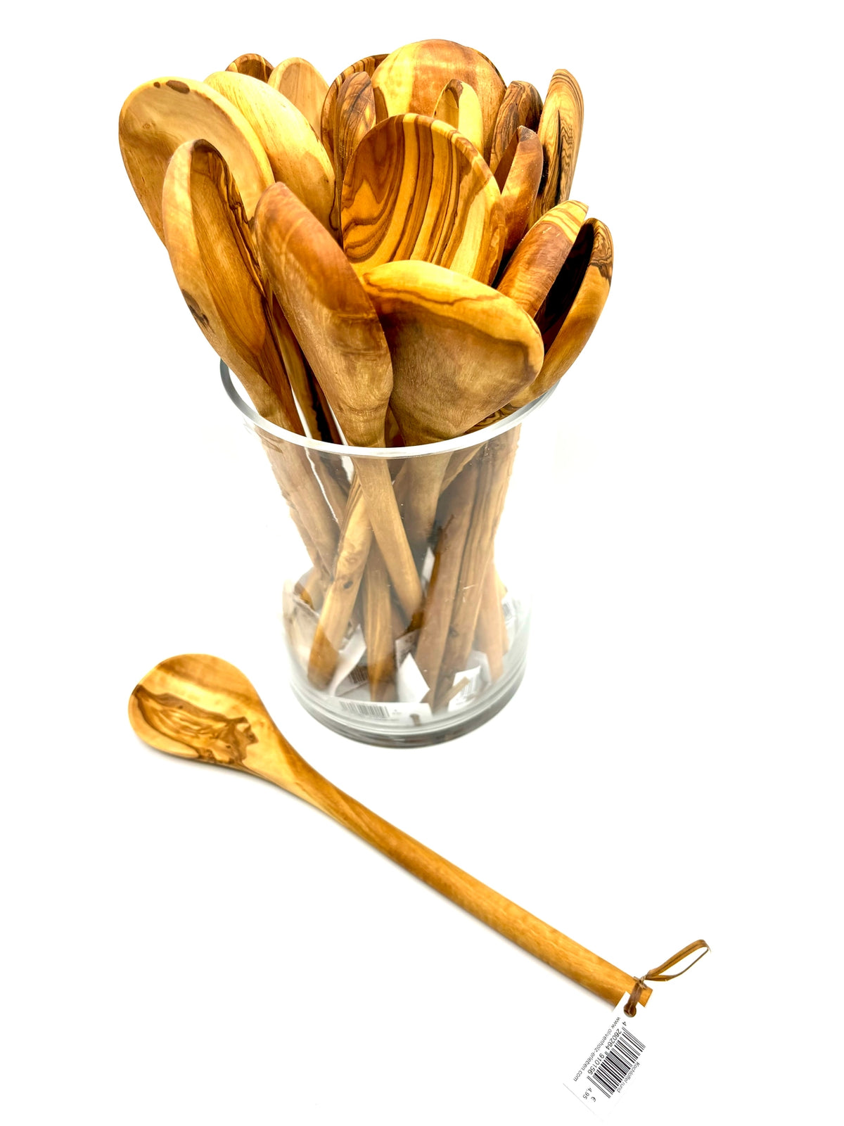 Close-up of round olive wood spoon showing natural grain