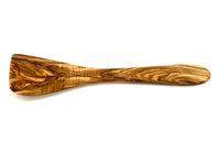 Close-up of olive wood flat spatula showing rich grain pattern