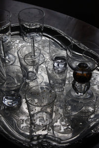 Othilia glassware by Olsson & Jensen on a metal tray