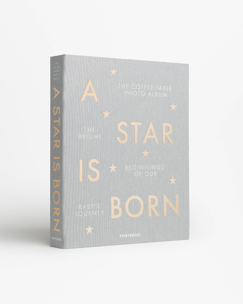 angled view of Printworks A Star Is Born baby album in grey

