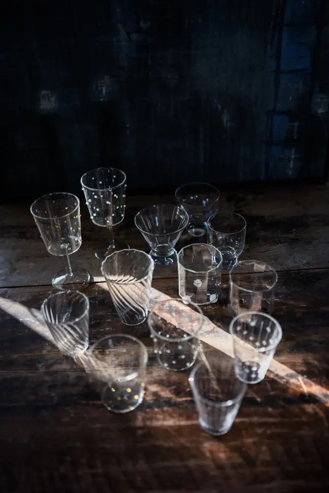 Palermo glasses by Olsson & Jensen styled on a dark table