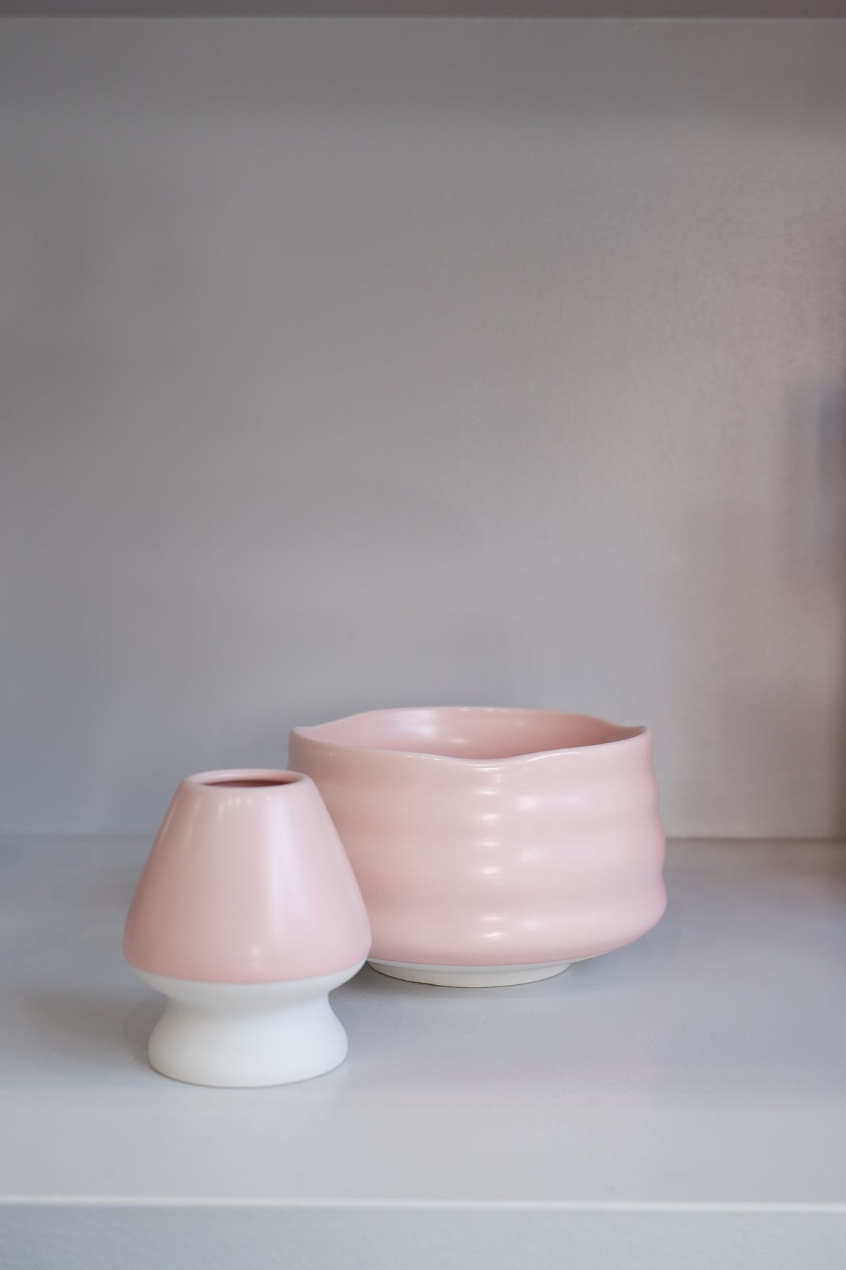 handmade pastel pink matcha bowl showing gentle curves and glaze variation