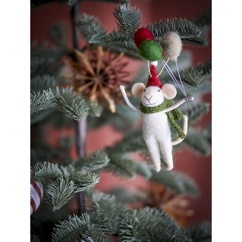 Felt wool mouse ornament with red hat and green scarf holding balloons on a Christmas tree