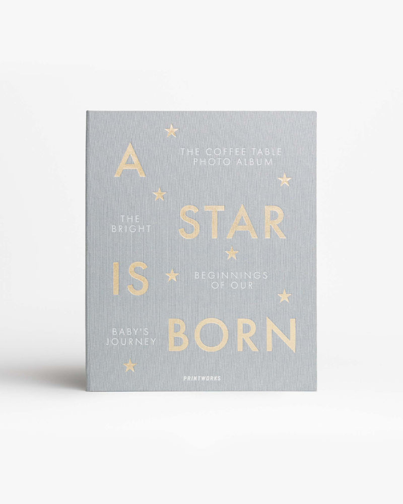 grey cloth baby album with gold text reading A Star Is Born

