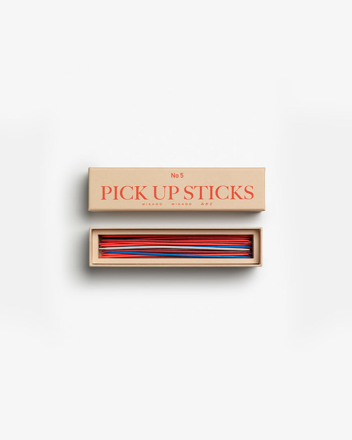 Open box showing colourful wooden sticks neatly arranged
