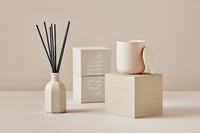 Pure Angora ceramic candle with matching gift box and reed diffuser in soft neutral tones
