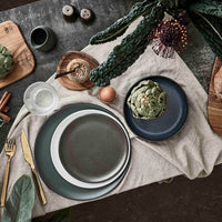 Nordic stoneware salt and pepper set styled with wooden serving boards