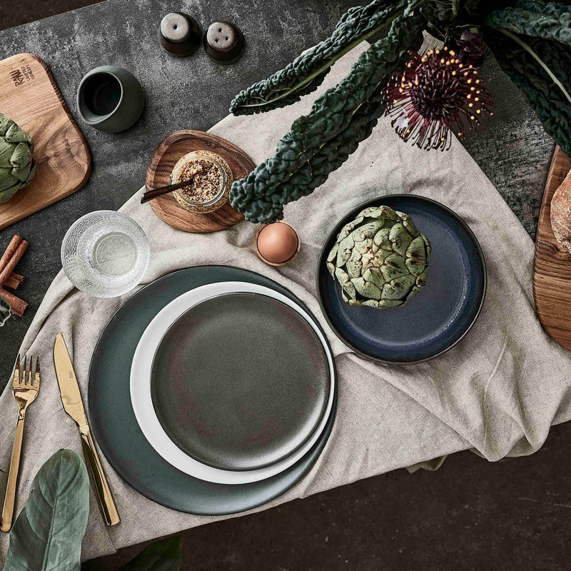 Nordic stoneware salt and pepper set styled with wooden serving boards