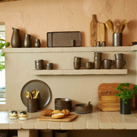 Minimalist salt and pepper shakers with other crockery for modern Nordic-inspired dining