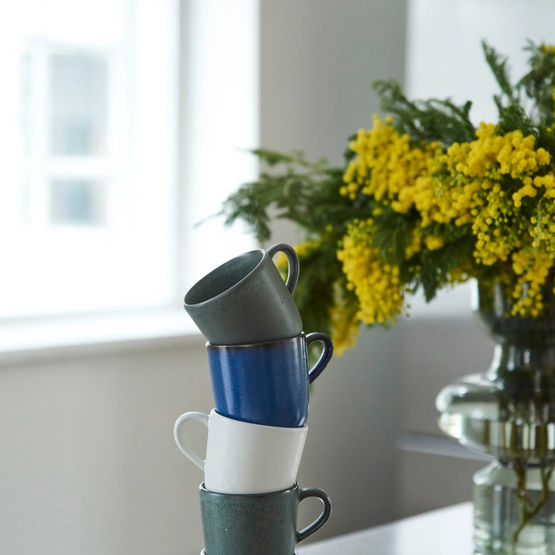 stacked RAW coffee cups by aida in northern green blue white and brown