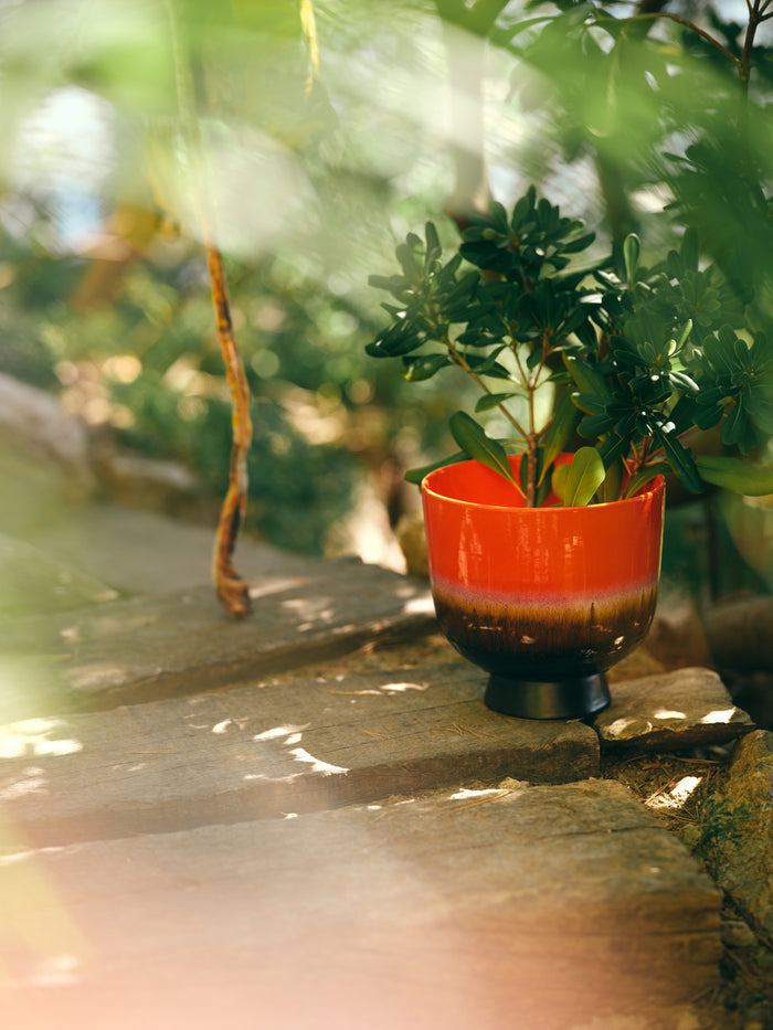 retro flower pot in cherry red by HKLIVING styled with green plant outdoors