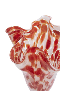 close-up of flowing sculptural rim and marbled glass pattern in rust and white
