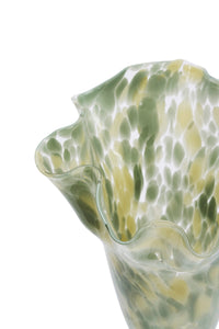 close up of sage green art deco glass vase with wavy sculptural rim
