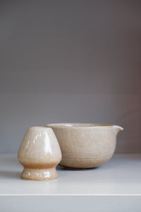 neutral speckled matcha bowl set in sand glaze showing spout detail
