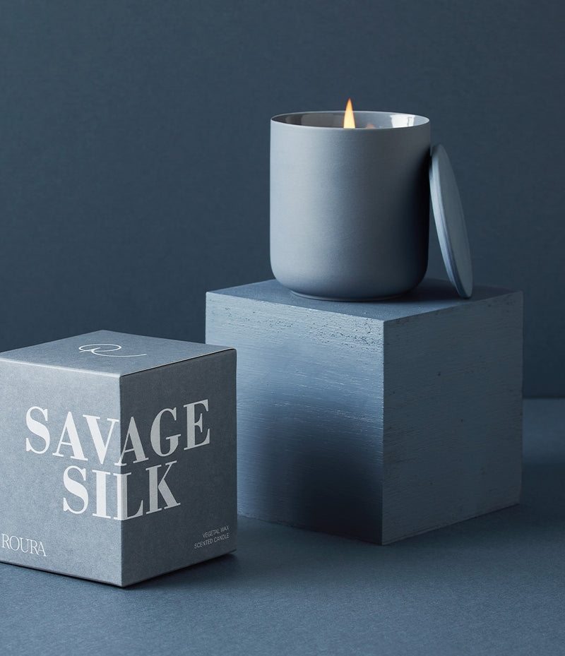 Savage Silk scented candle in matte blue ceramic vessel with lid and gift box
