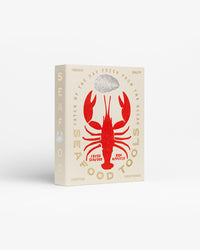 Angled view of Seafood Tools box with gold details
