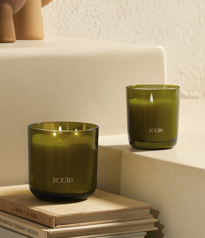 Secret Garden scented candles in two sizes, single wick and three wick in green glass