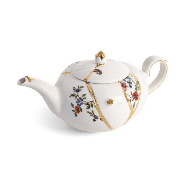 Seletti Kintsugi porcelain teapot with real gold seam detailing, cut-out side view
