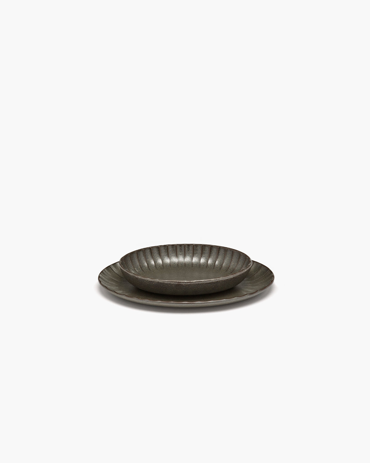 Side view of the green Inku oval serving bowl by Serax