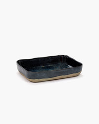 Merci No.10 oven dish in dark blue stoneware for Serax on a white background