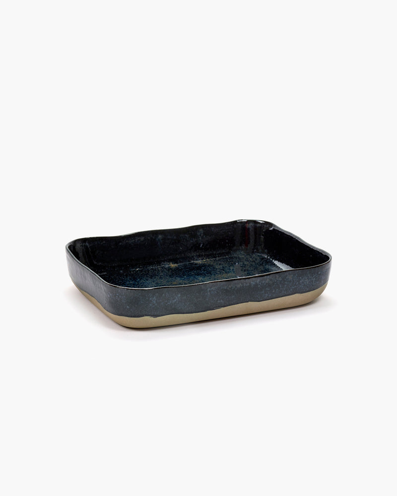 Merci No.10 oven dish in dark blue stoneware for Serax on a white background