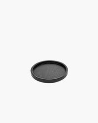 Passe-partout round coaster in black carbonised ash by Vincent Van Duysen for Serax