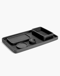 Passe-partout carbonised ash trays and coasters by Serax grouped together