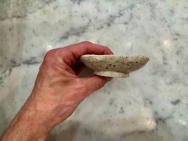 Side profile of raised handmade ceramic soap dish for dry soap storage