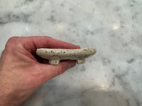 Side profile of square footed ceramic soap holder to prevent soggy bars