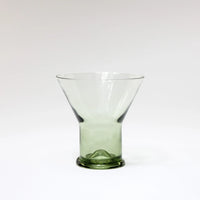 Siena flared clear glass with a green glass foot by Olsson & Jensen on a white background