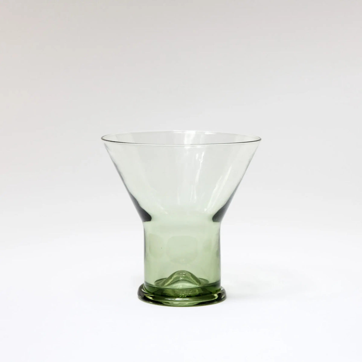 Siena flared clear glass with a green glass foot by Olsson & Jensen on a white background