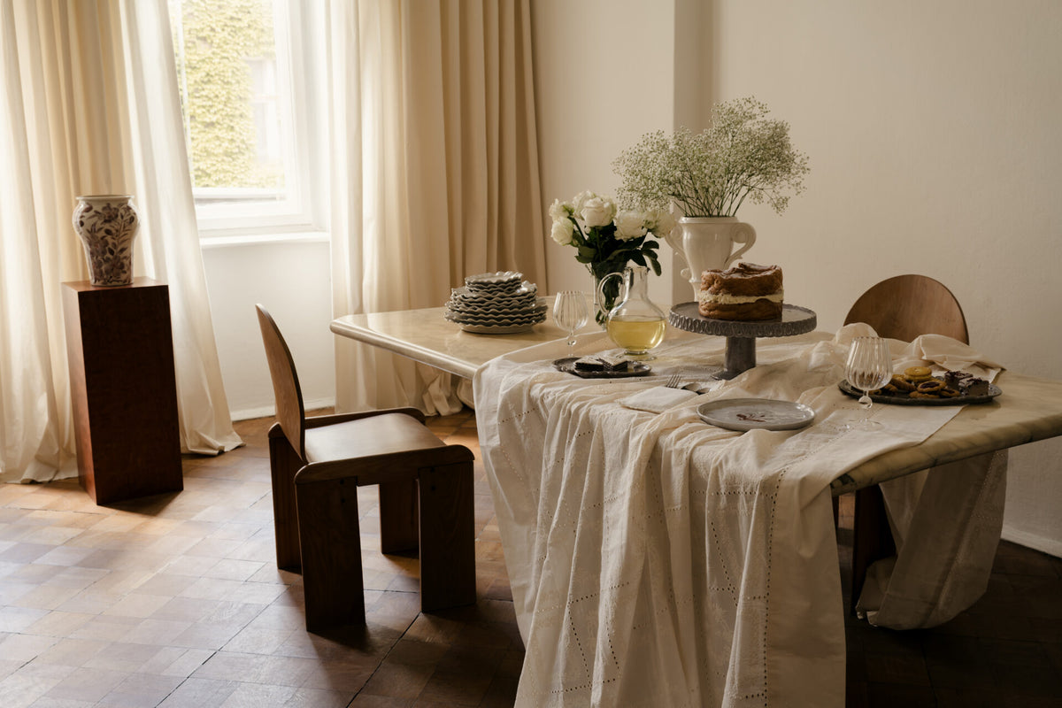 Skye wine glasses by Olsson & Jensen on a dining table set with linen