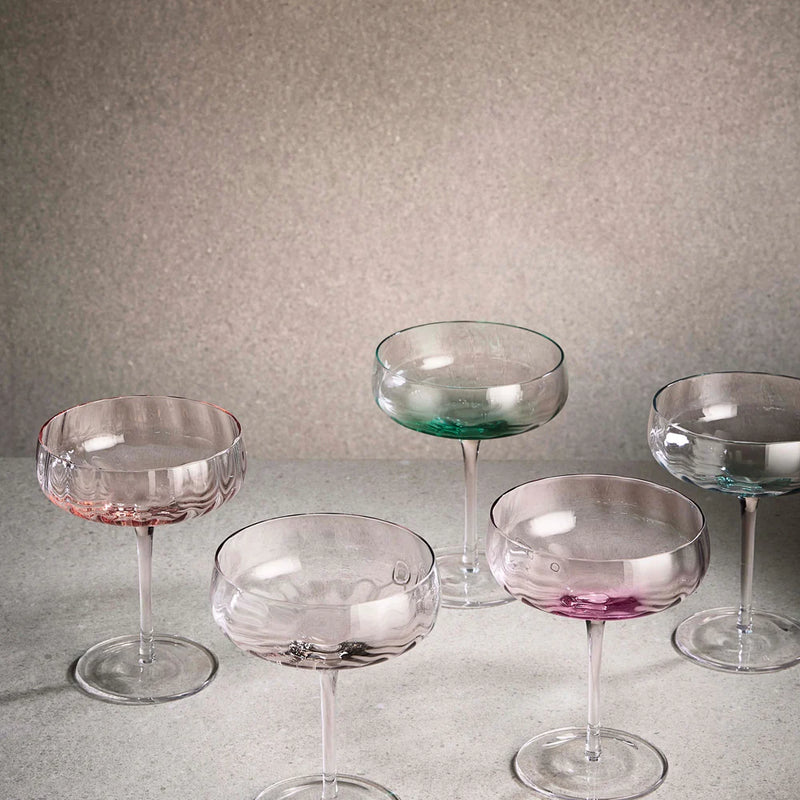 Set of colorful glass cocktail glasses from Aida SØHOLM Sonja collection on a neutral background