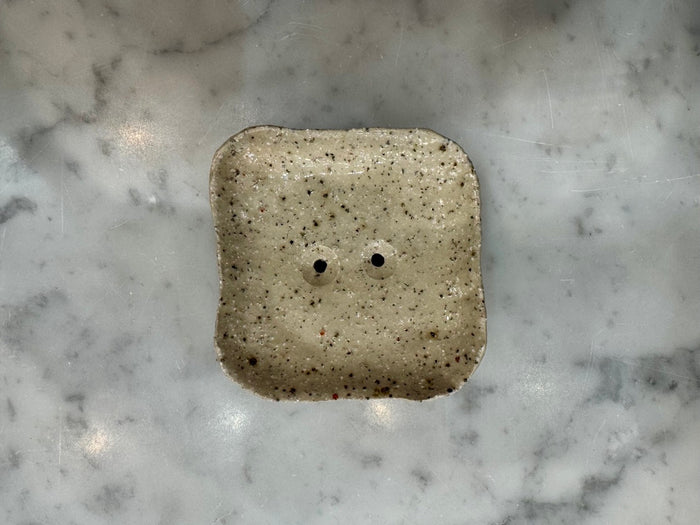 Square handmade soap dish in speckled glaze with drainage holes by Lee Simmonds