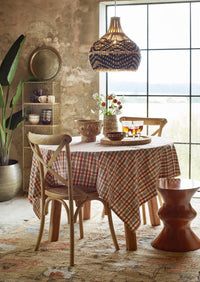 textured wine glasses styled on a relaxed dining table with ceramics and linens
