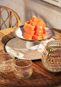 beige and brown stoneware pedestal dish serving chocolate truffles and treats

