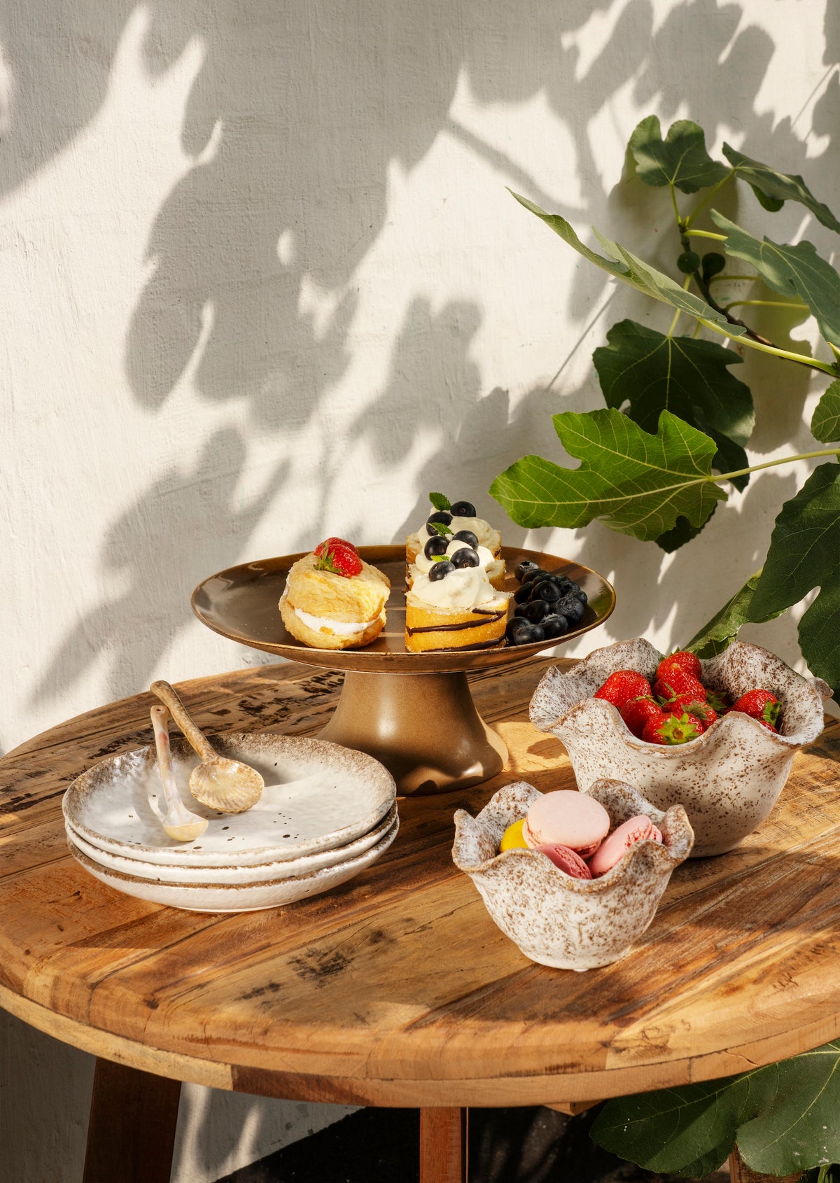 beige and brown matching speckled stoneware plates and bowls styled together

