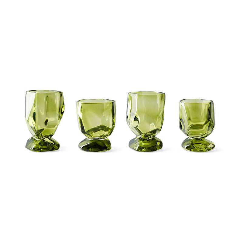 Set of four Nienke Sikkema for HKLIVING emerald green wine glasses on white background showing variation in size and form