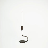 Steffi 22 cm black cast iron taper candle holder by Olsson & Jensen holding a white dinner candle