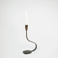 Steffi 30 cm black cast iron taper candle holder by Olsson & Jensen holding a white dinner candle