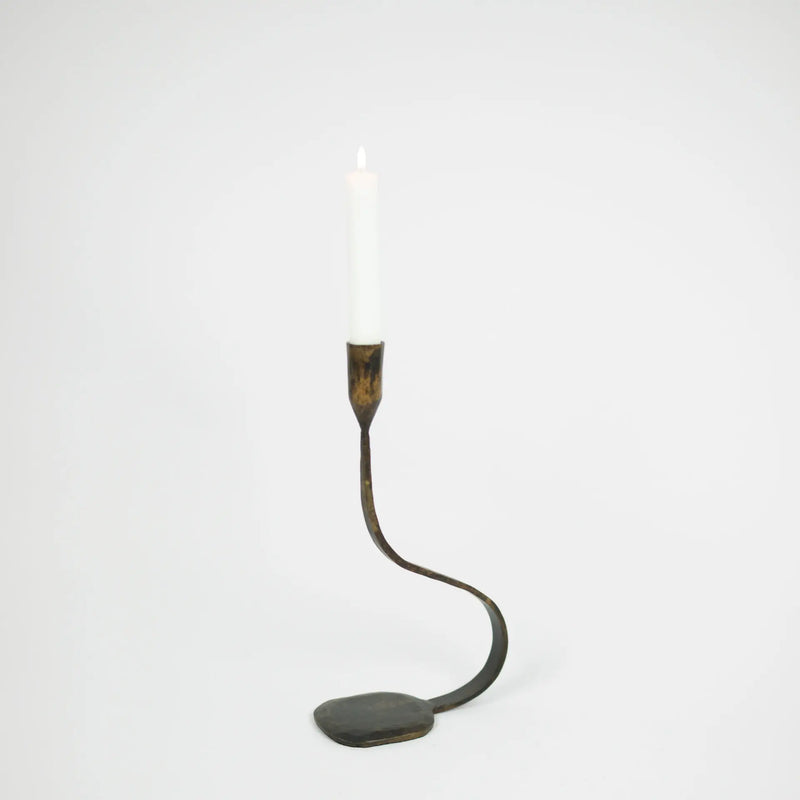 Steffi 30 cm black cast iron taper candle holder by Olsson & Jensen holding a white dinner candle