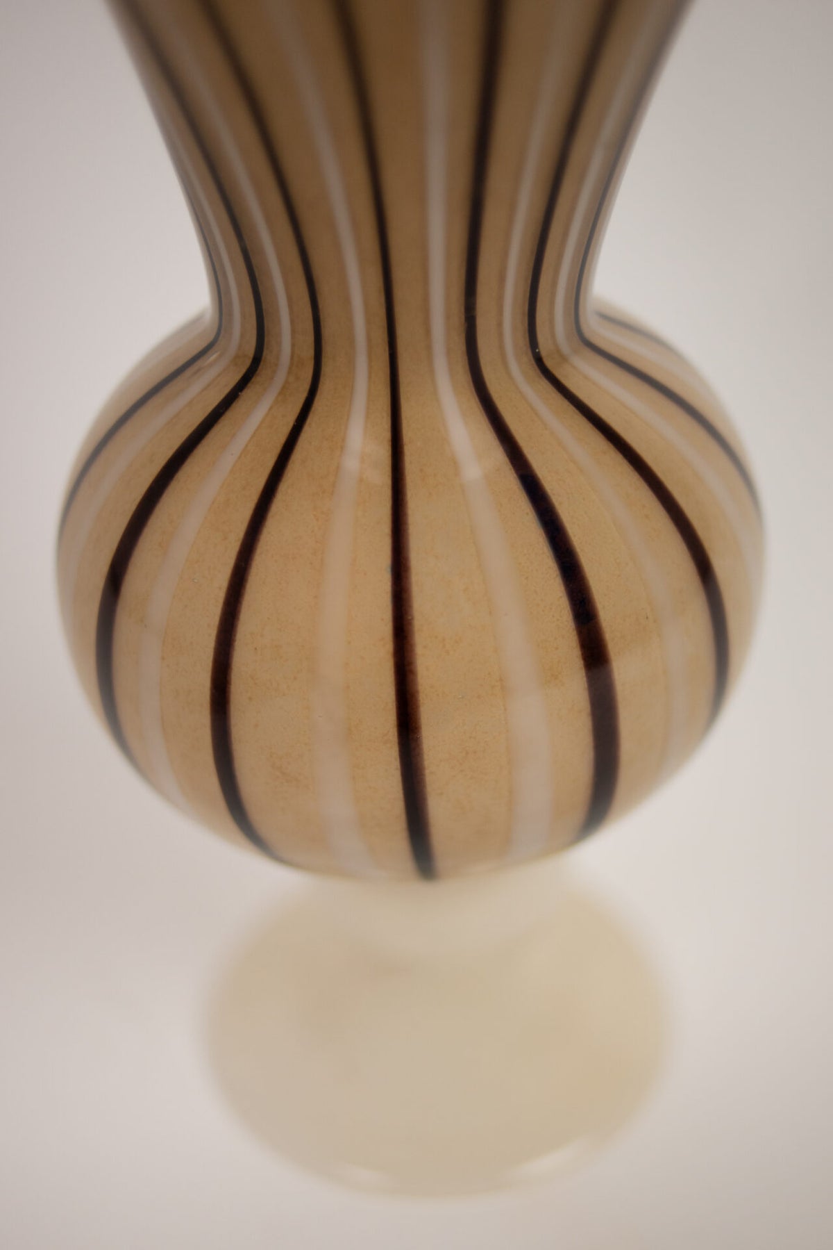 Close-up of the striped body and foot of the Stria vase by Olsson & Jensen