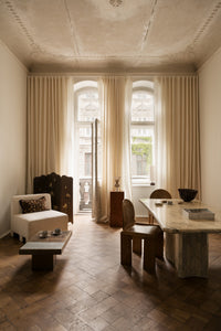 Stria vase by Olsson & Jensen in a living and dining room