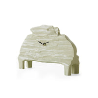 Three-quarter angle view of the HKLIVING seafoam mantle clock, highlighting the carved texture and curved silhouette of the sage-green wood case