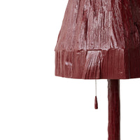 close-up of the carved, glossy burgundy texture on the Teun Zwets for HKLIVING floor lamp shade, with pull cord detail