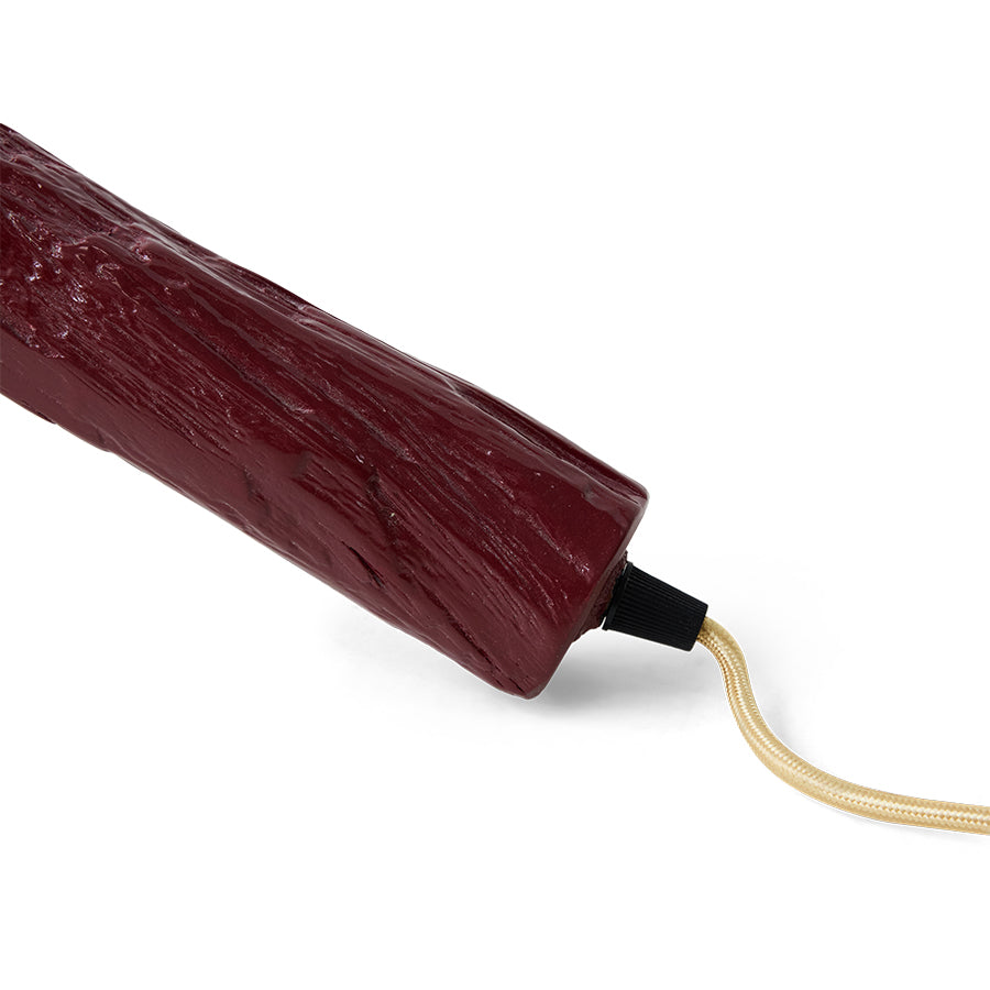 close-up of the cable outlet on the burgundy Sungkai wood column of the Teun Zwets for HKLIVING floor lamp