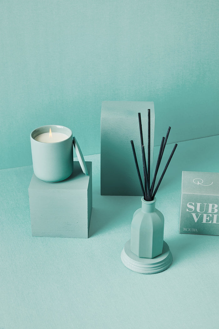 Sublime Velvet ceramic candle with matching box and reed diffuser in soft aqua tones
