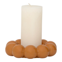 Talon candle holder with an ivory pillar candle